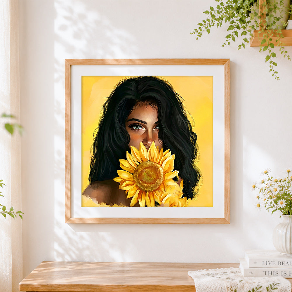 Finished woman with a sunflower cross stitch artwork displayed