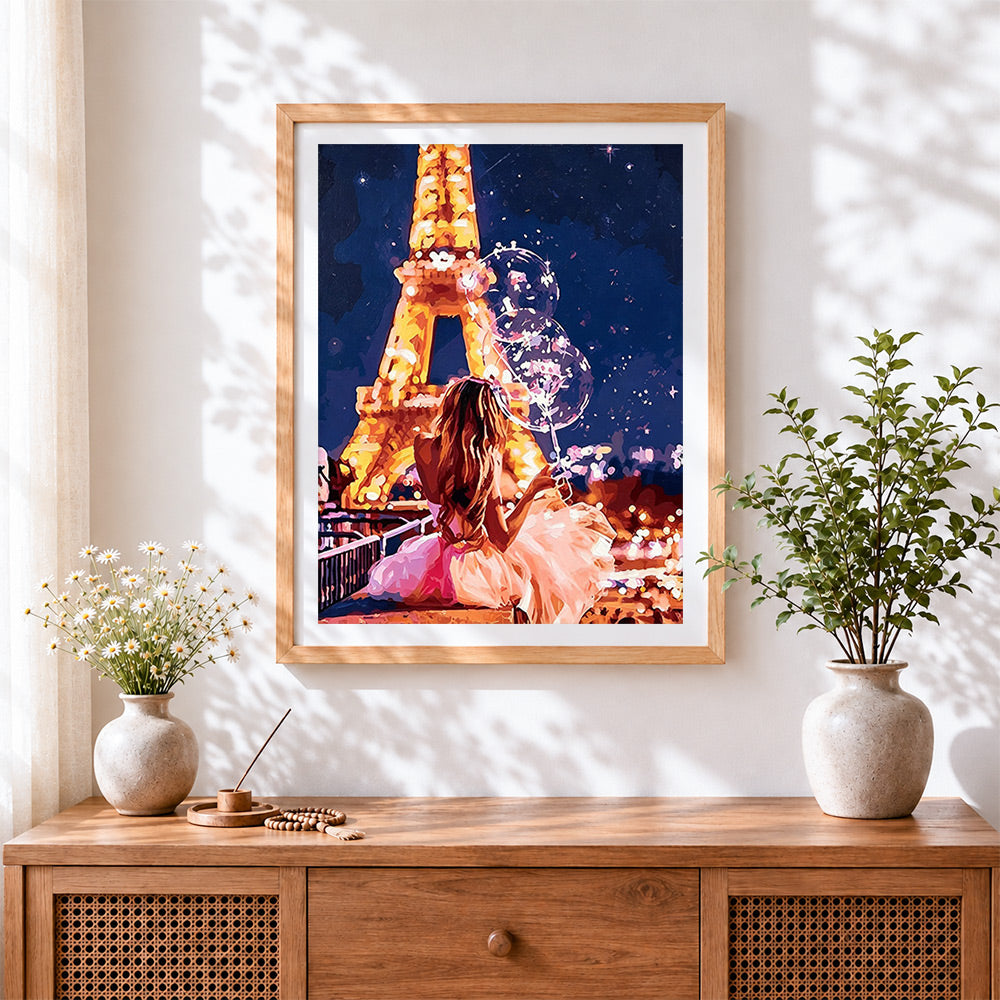 Finished woman with balloons at the eiffel tower paint by numbers artwork displayed as home decor