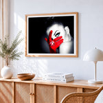 Woman with blue eye and red glove paint by numbers artwork displayed on wall as home decor