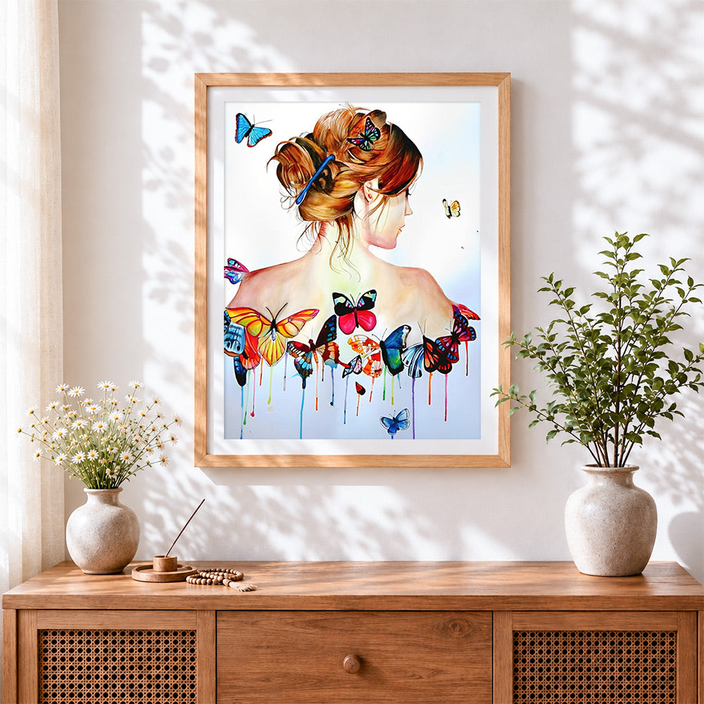 Finished woman with butterflies on back cross stitch artwork displayed