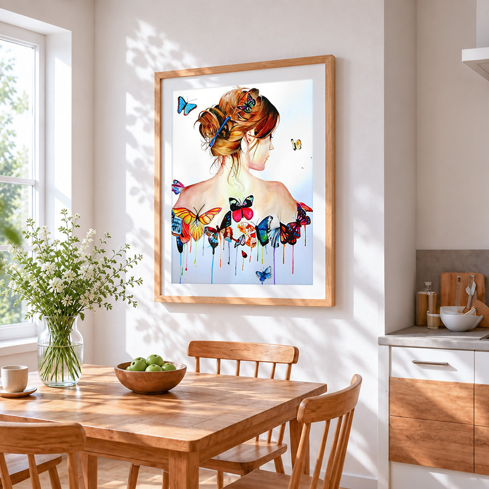 Woman with butterflies on back cross stitch artwork displayed on wall as home decor