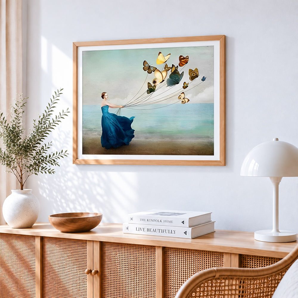 Woman with butterfly balloons by the sea paint by numbers artwork displayed on wall as home decor