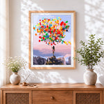 Finished woman with colourful balloons on a mountain cross stitch artwork displayed