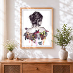 Finished woman with colourful butterflies on her back cross stitch artwork displayed