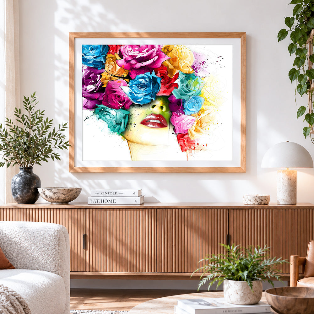 Finished woman with colourful floral hair cross stitch artwork displayed