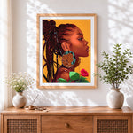 Finished woman with leopard print earring cross stitch artwork displayed