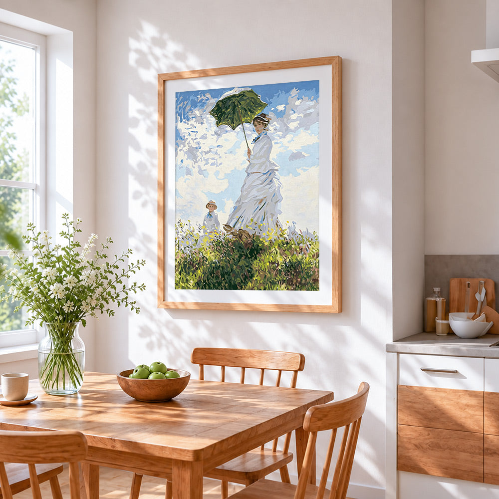 Woman with parasol in meadow cross stitch artwork displayed on wall as home decor