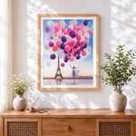 Finished woman with pink balloons cross stitch artwork displayed