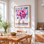Woman with pink balloons cross stitch artwork displayed on wall as home decor