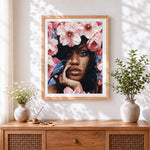 Finished woman with pink blossoms cross stitch artwork displayed