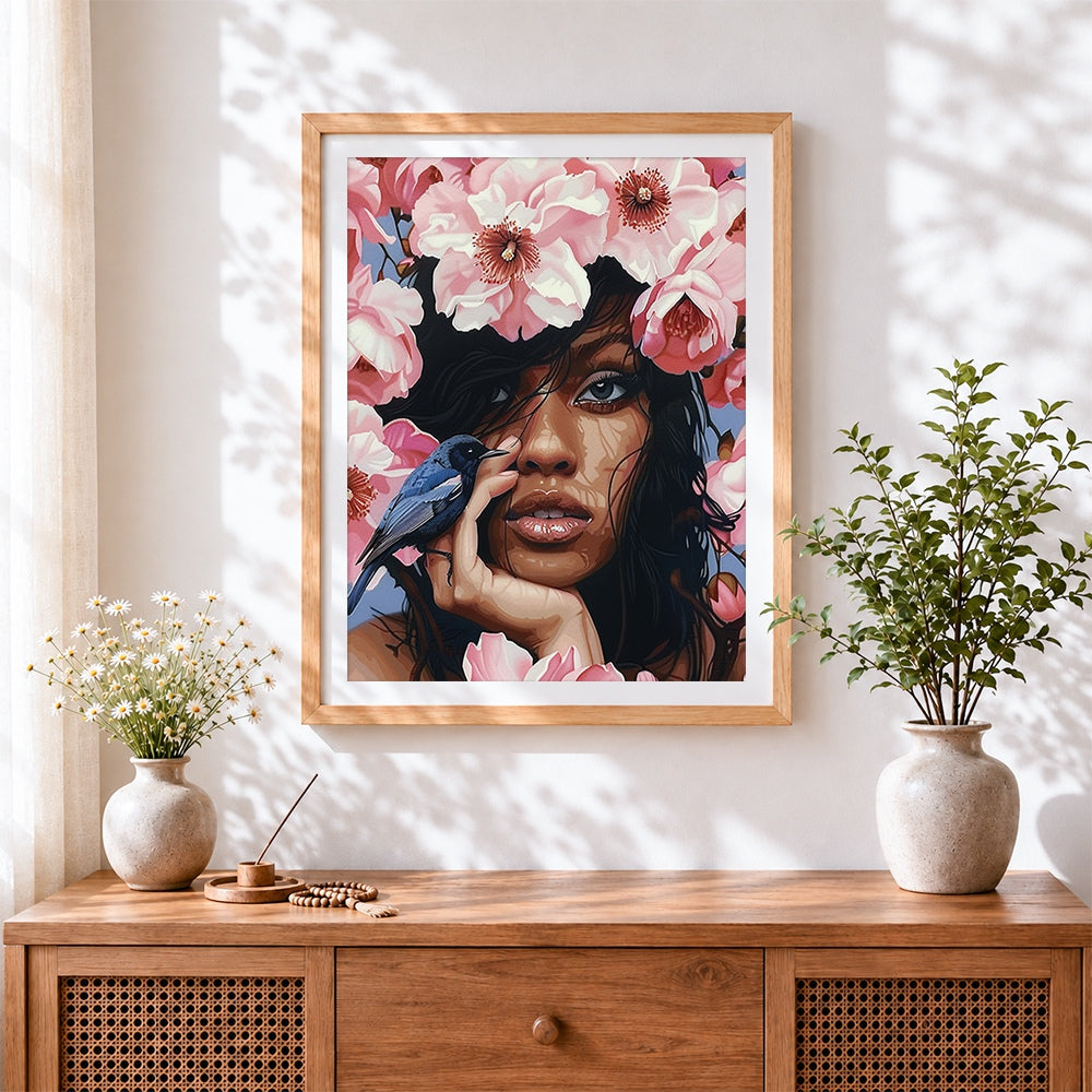 Finished woman with pink blossoms cross stitch artwork displayed