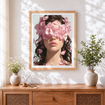 Finished woman with pink blossoms over eyes cross stitch artwork displayed