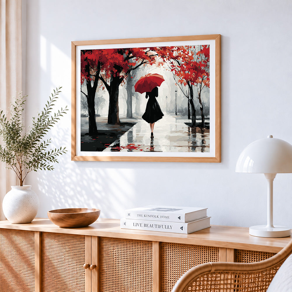 Woman with red umbrella in autumn rain paint by numbers artwork displayed on wall as home decor