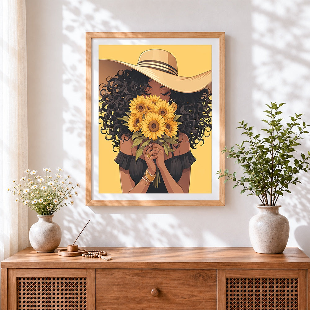 Finished woman with sunflower bouquet cross stitch artwork displayed