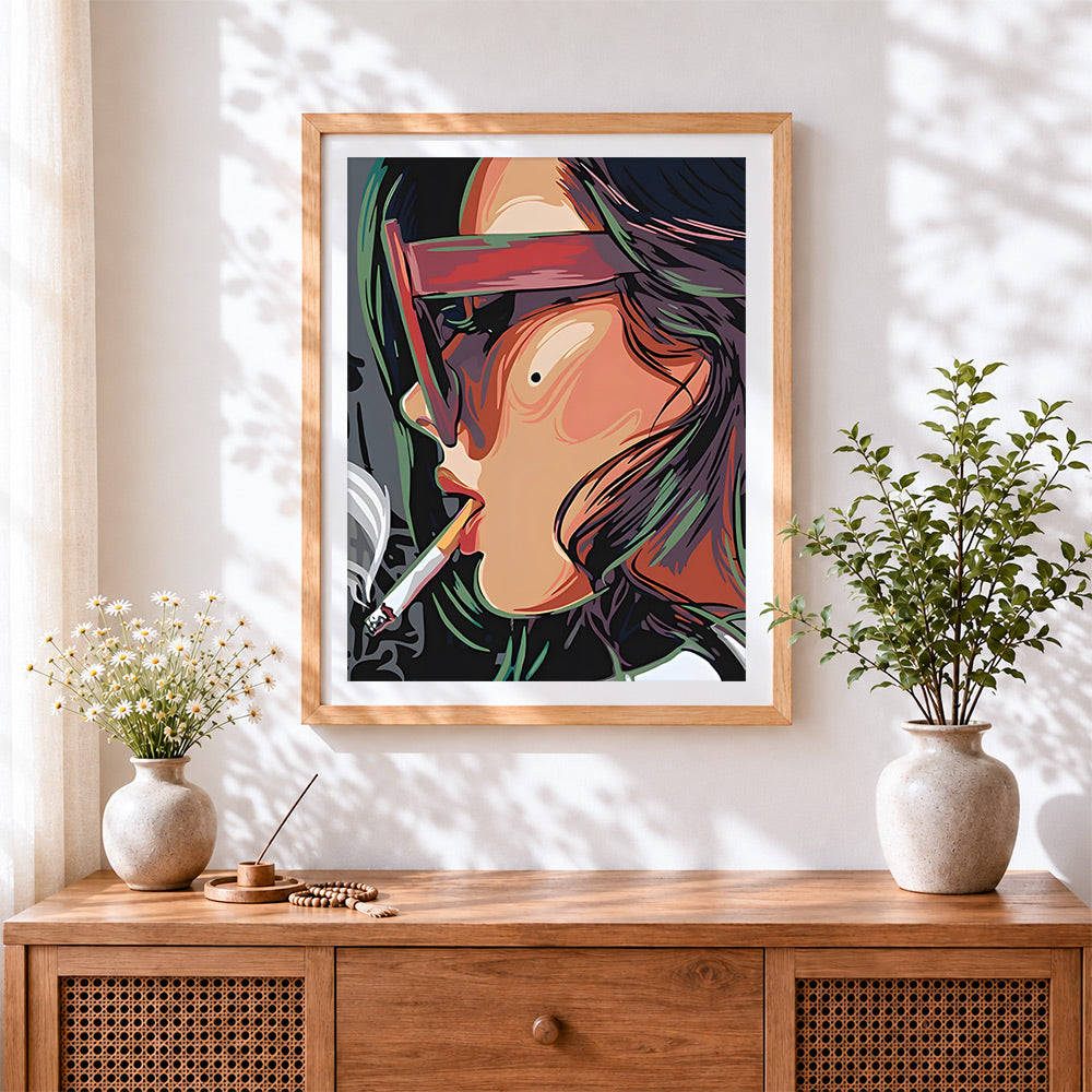 Finished woman with sunglasses and cigarette cross stitch artwork displayed