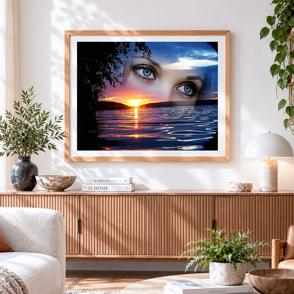 Finished womans eyes and sunset lake paint by numbers artwork displayed as home decor
