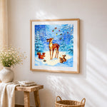 Woodland deer and squirrel in snow cross stitch artwork displayed on wall as home decor