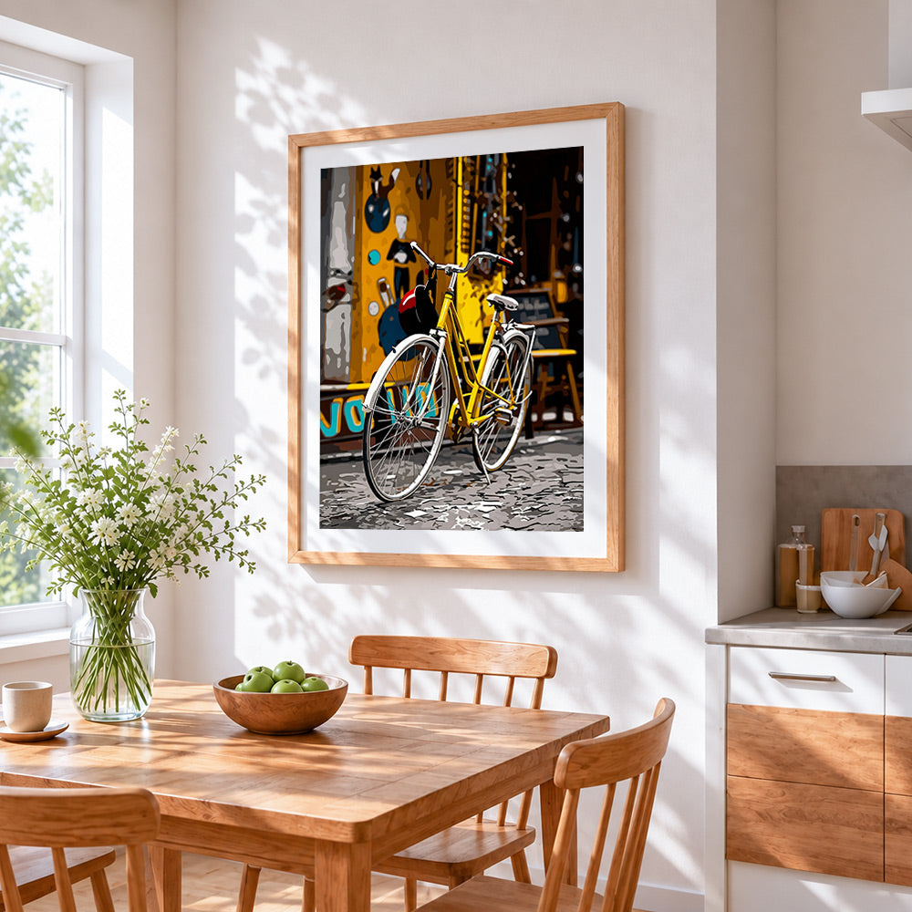 Yellow bicycle in the city cross stitch artwork displayed on wall as home decor