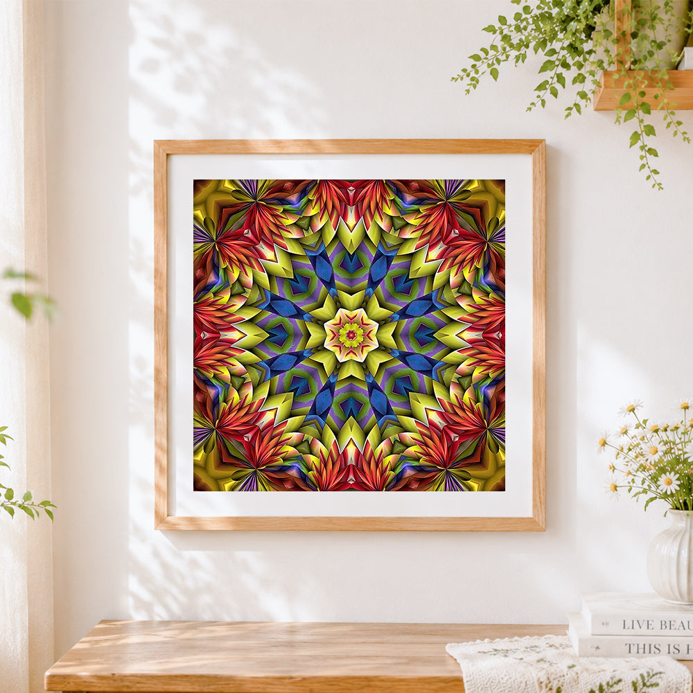 Finished yellow red and blue kaleidoscope mandala cross stitch artwork displayed