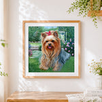 Finished yorkshire terrier in a flower garden cross stitch artwork displayed