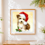 Finished yorkshire terrier puppy with santa hat and holly cross stitch artwork displayed