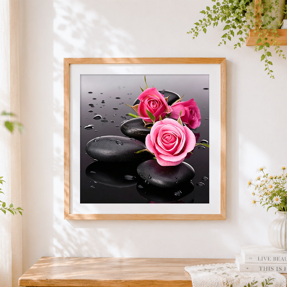 Finished zen black stones and pink roses paint by numbers artwork displayed as home decor