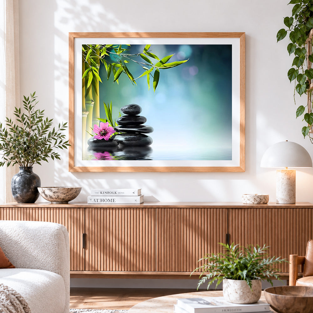 Finished zen spa stones with bamboo and pink flower cross stitch artwork displayed