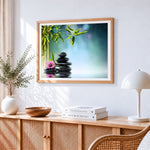 Zen spa stones with bamboo and pink flower cross stitch artwork displayed on wall as home decor